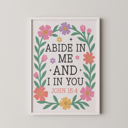 A modern illustrative wall art featuring pink, yellow, and lavender blossoms framing the scripture "Abide in Me and I in You, John 15:4".