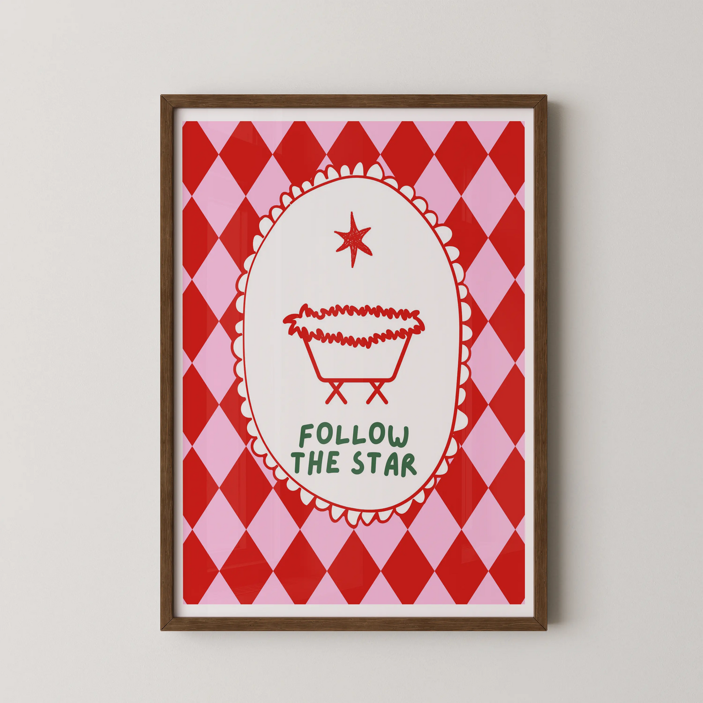 A modern graphic art print of a baby carriage in a scalloped frame on an argyle background, with the text "FOLLOW THE STAR".