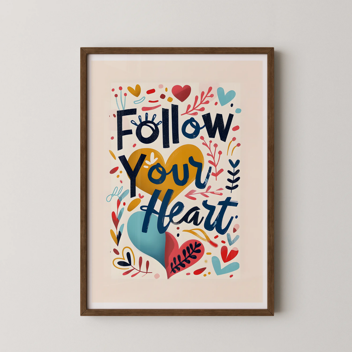 A modern wall art poster with the text "Follow Your Heart" in bold display type, surrounded by decorative elements and hearts, in a pop-folk hand-lettering style.