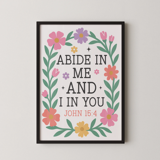 A modern illustrative wall art featuring pink, yellow, and lavender blossoms framing the scripture "Abide in Me and I in You, John 15:4".