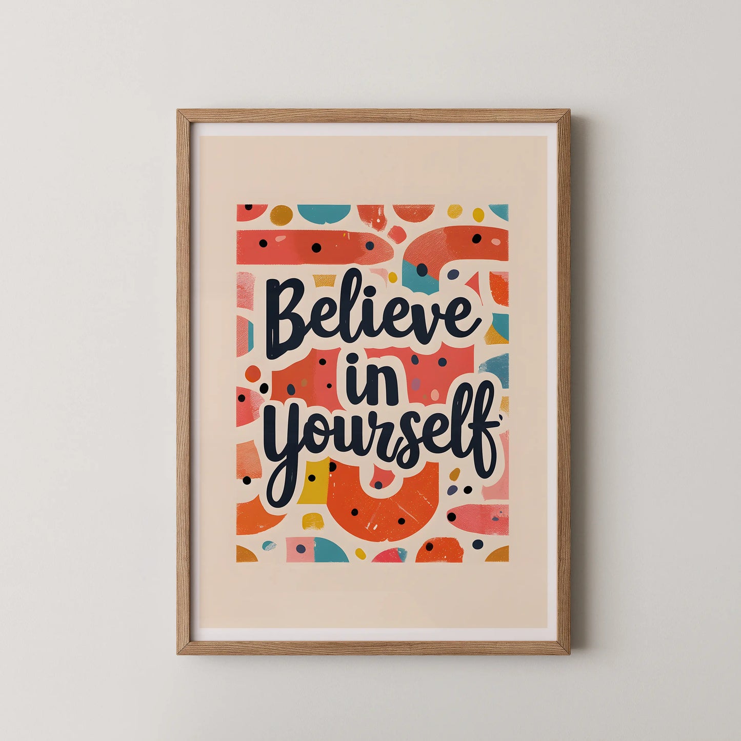 A pop art style wall art poster featuring bold, hand-lettered typography that reads Believe in yourself, surrounded by vibrant geometric shapes.