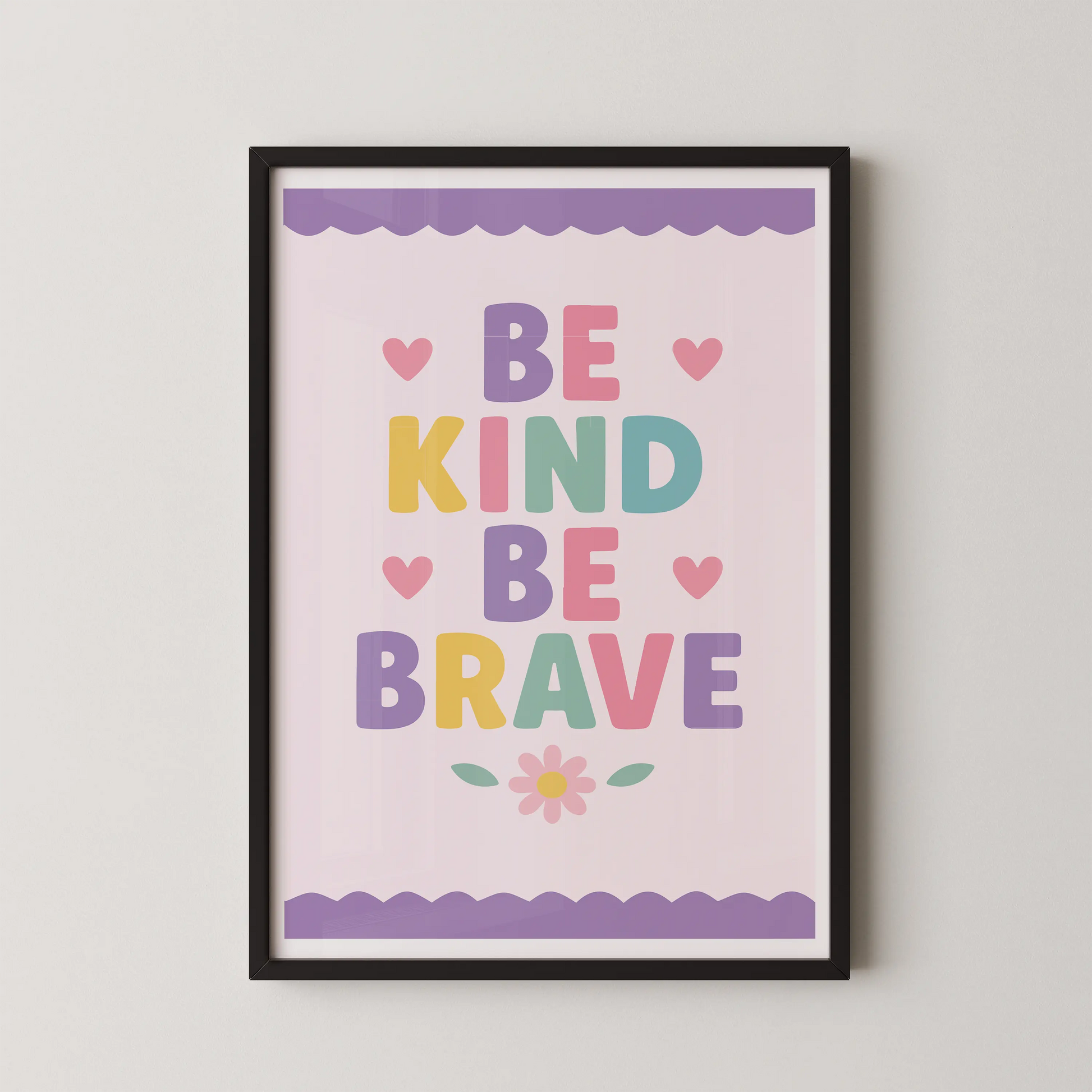 A modern typographic poster with the words "BE KIND BE BRAVE" in pastel rounded letters, adorned with pink hearts and a daisy.