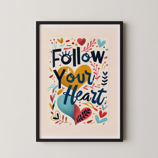 A modern wall art poster with the text "Follow Your Heart" in bold display type, surrounded by decorative elements and hearts, in a pop-folk hand-lettering style.