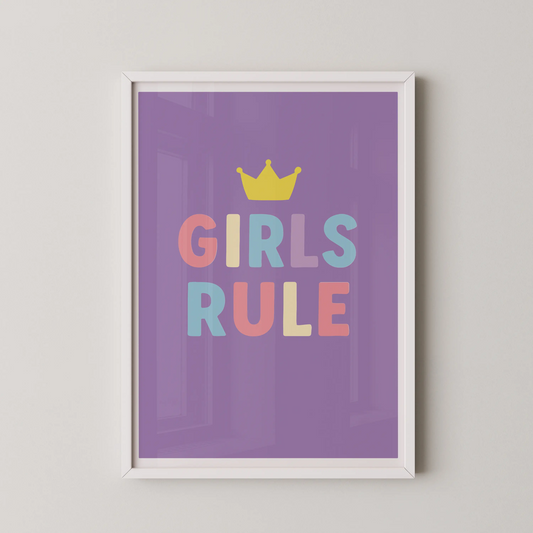 A pop art style graphic design featuring the text "GIRLS RULE" with a crown, in pastel colors.