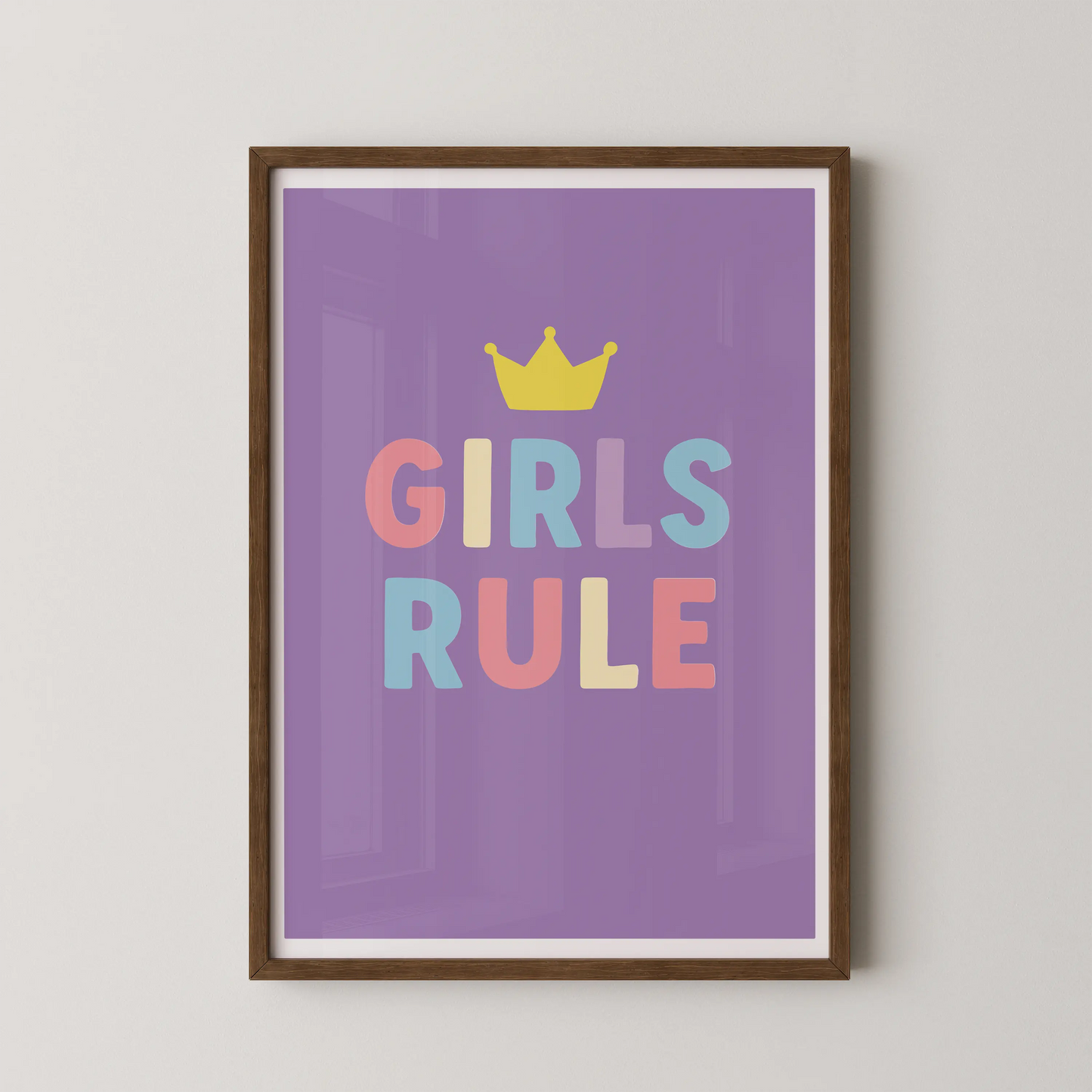 A pop art style graphic design featuring the text "GIRLS RULE" with a crown, in pastel colors.